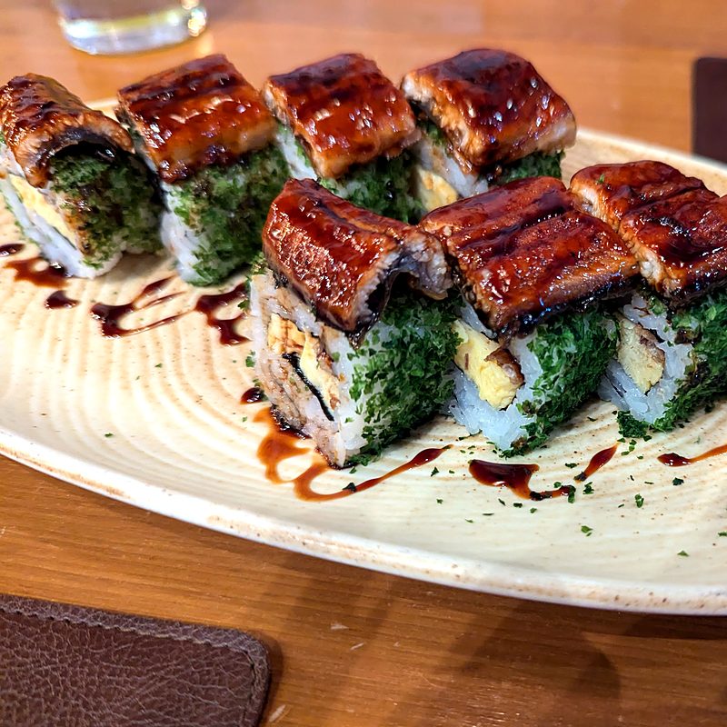 Sushi rolls topped with glazed grilled eel