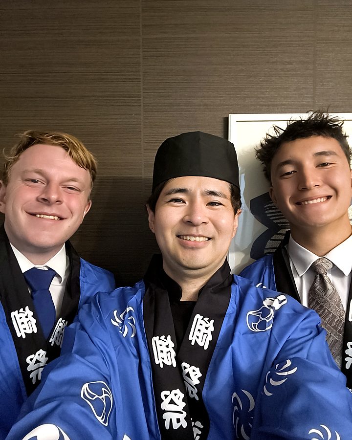 Guests taking a selfie with the sushi chef