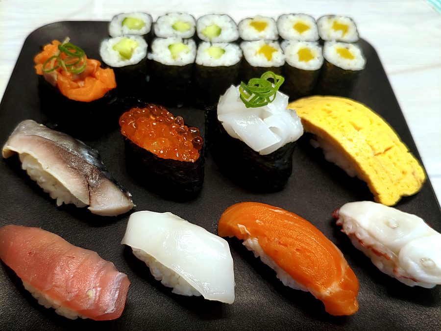 A plate of nigiri, gunkan and maki rolls made by a student